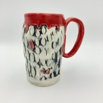 handmade-ceramic-mug-with-black-and-white-texture-and-red-handle