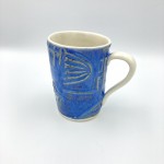 gorgeous-watery-blue-glaze-covers-the-textured-design-on-this-handbuilt-ceramic-mug